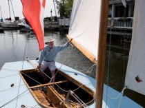 Robert Gallant sits in a restored wooden sail boat at the Pointe-Claire Yacht Club in Montreal on Monday August 17, 2015. Gallant helped restore the boat to its original glory and it is thought to be the only remaining boat from the original group of 23 Pointe-Claire One designed boats. The boats date back to 1933 when the club began acquiring them as racing boats.